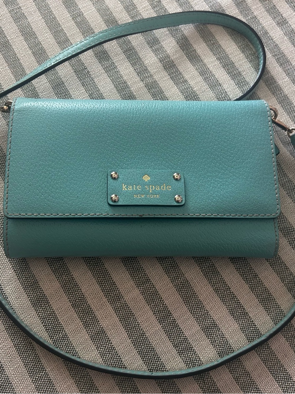 kate spade turquoise crossbody wallet with gold logo plate